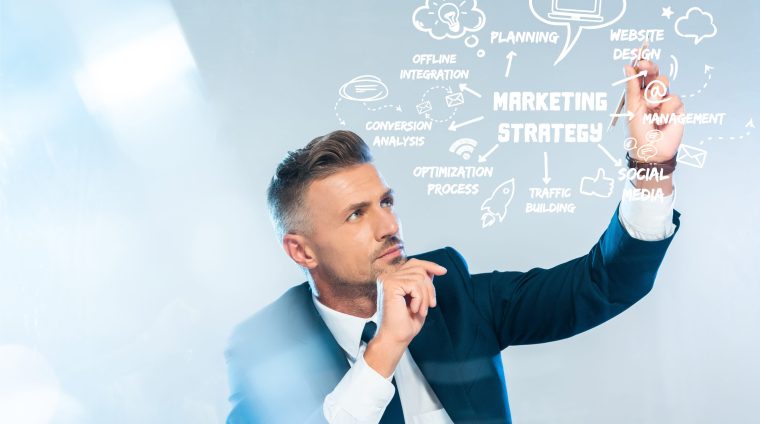 handsome businessman drawing marketing strategy isolated on white, artificial intelligence concept handsome businessman drawing marketing strategy isolated on white, artificial intelligence concept