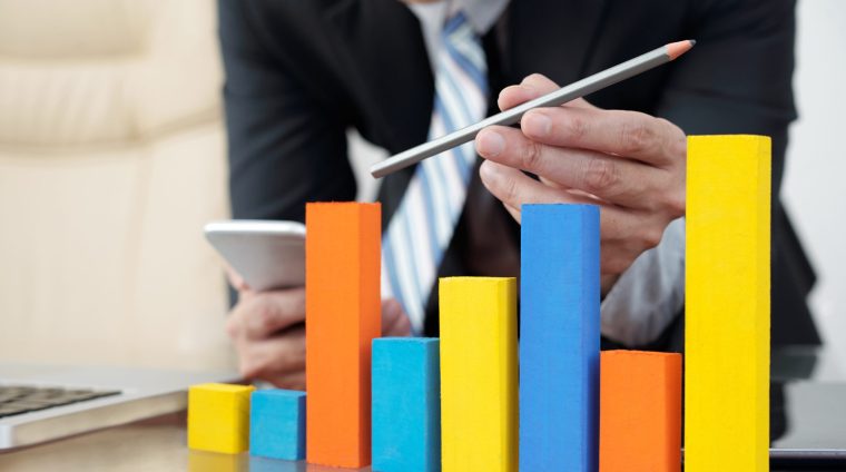 Sales chart Close-up image of sales manager analyzing ascending trend